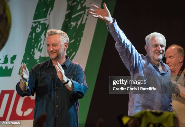 Labour Party leader Jeremy Corbyn leaves next to Billy Bragg after speaking to crowds at Left Field Stage at Glastonbury Festival Site on June 24,...