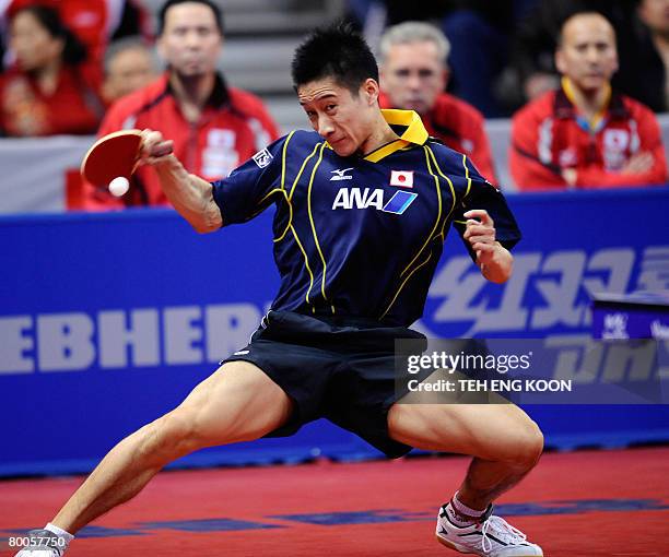 Japan's Yoshida Kaii returns a shot against Taiwan's Chuan Chihyuan during the men's quarter-final and position match at the World Team Table Tennis...