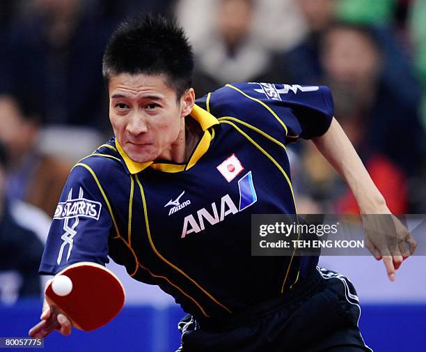 Japan's Yoshida Kaii returns a shot against Taiwan's Chuan Chihyuan during the men's quarter-final and position match at the World Team Table Tennis...