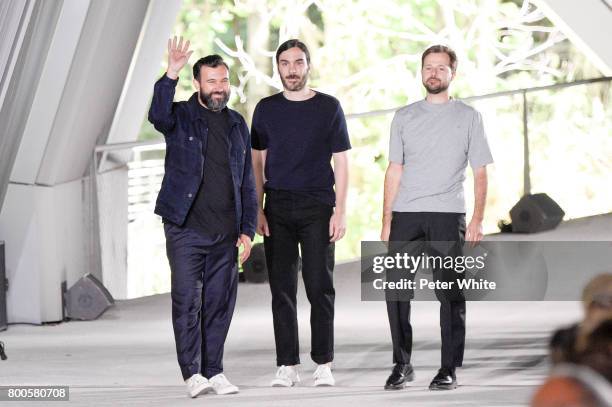 Designers Jose Lamali, Jeremie Egry and Aurelien Arbet acknowledge the audience after the Etudes Menswear Spring/Summer 2018 show as part of Paris...