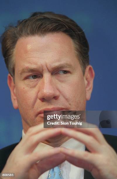 The Shadow Chancellor of the Exchequer Michael Portillo listens at a press conference at the Conservative Central Office April 11, 2001 in London,...