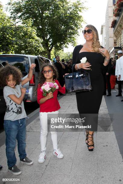 Singer Mariah Carey, Monroe Cannon and Moroccan Scott Cannon leave the Plaza Athenee Dorchester Collection Hotel on Avenue Montaigne on June 24, 2017...