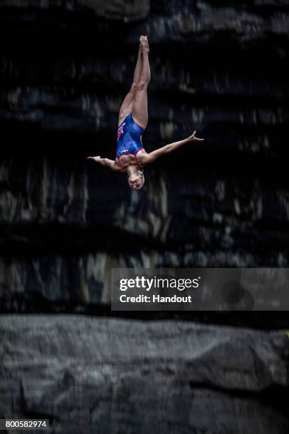 In this handout image provided by Red Bull, Rhiannan Iffland of Australia dives from the 21 metre platform at the Serpent`s Lair during the first...