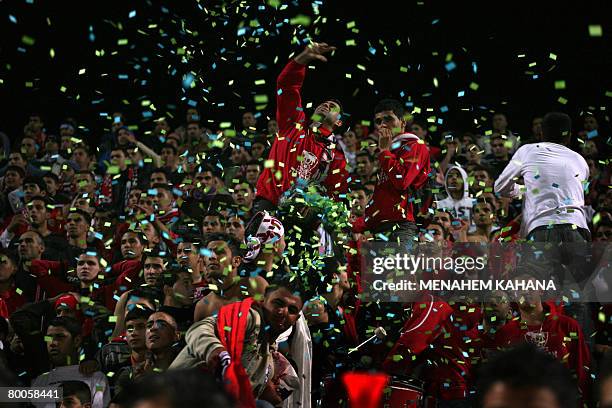 Confetti falls over Israeli Arab Bnei Sakhnin players following their national football cup match against Beitar Jerusalem in the northern Israeli...