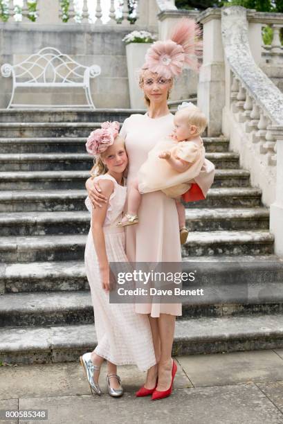 Tatiana Korsakova wearing a Roksanda dress , Arturo Rios Hat, BUwood bag and Kurt Geiger shoes poses with her two daughters Varvara and Aleksandra...