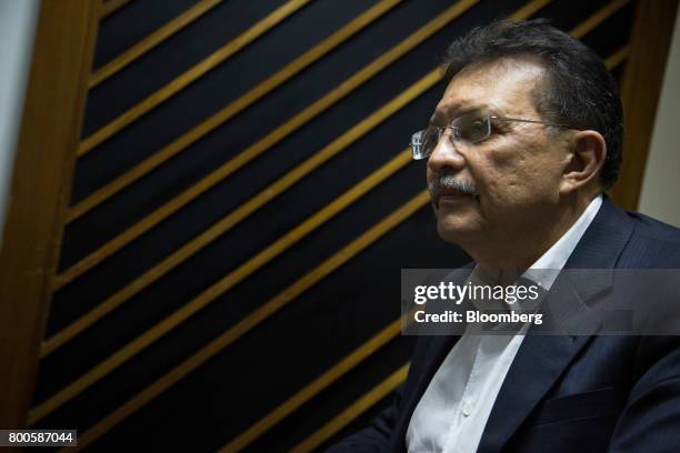 German Ferrer, deputy of the National Assembly for the United Socialist Party of Venezuela , listens during an interview in Caracas, Venezuela, on...