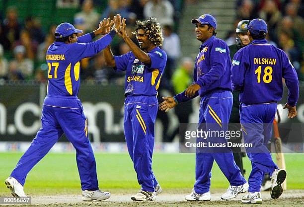 Lasith Malinga and Sri Lanka players celebrate a wicket during the Commonwealth Bank Series One Day International match between Australia and Sri...