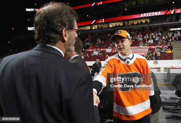 Matthew Strome meets general manager Ron Hextall after being selected 106th overall by the Philadelphia Flyers during the 2017 NHL Draft at United...