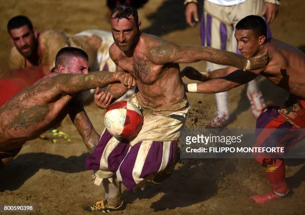 Players compete during the final match of the Calcio Storico Fiorentino traditional 16th Century Renaissance ball game, on Piazza Santa Croce in...