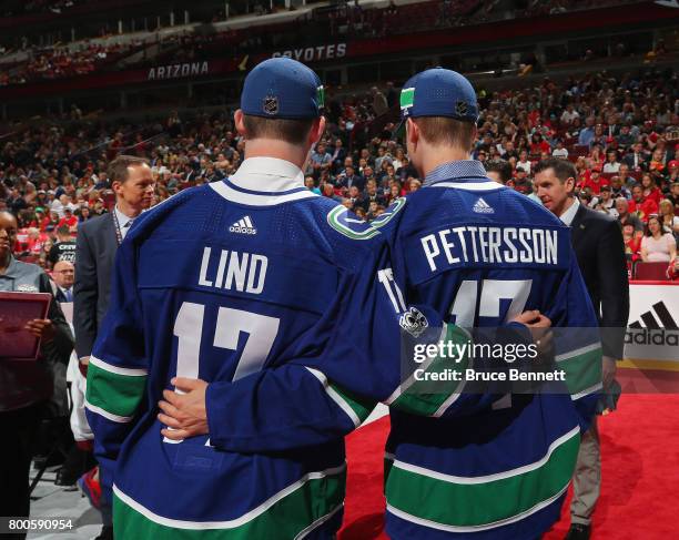 Elias Pettersson, right, and Kole Lind pose for photos after being drafted by the Vancouver Canucks during the 2017 NHL Draft at the United Center on...