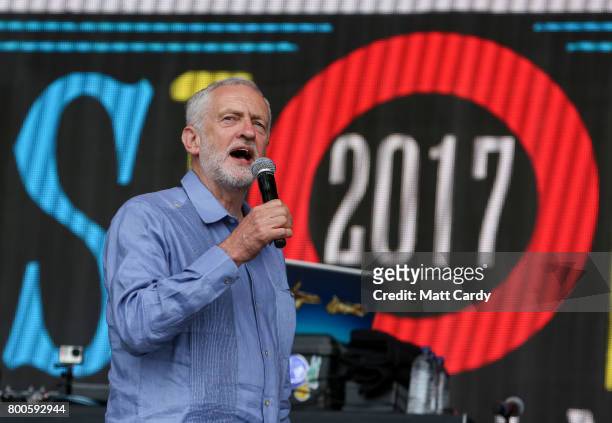 Labour Party leader Jeremy Corbyn address the crowd from the main stage a the Glastonbury Festival site at Worthy Farm in Pilton on June 24, 2017...