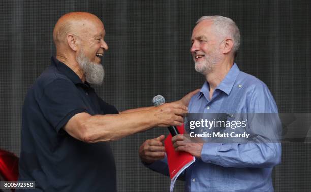 Labour Party leader Jeremy Corbyn and festival founder Michael Eavis address the crowd from the main stage at the Glastonbury Festival site at Worthy...