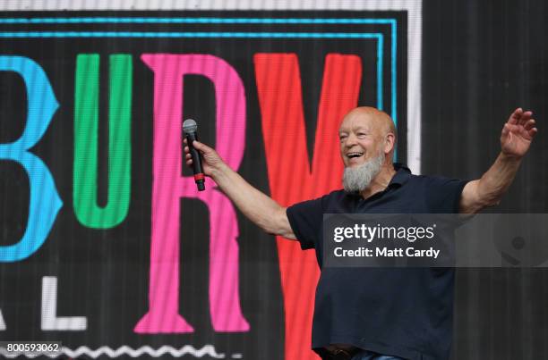 Festival founder Michael Eavis address the crowd from the main stage at the Glastonbury Festival site at Worthy Farm in Pilton on June 24, 2017 near...