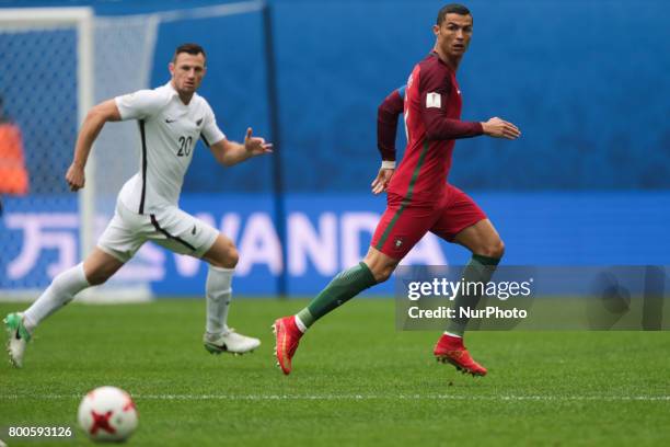 Tommy Smith of the New Zealand national football team and Cristiano Ronaldo of the Portugal national football team vie for the ball during the 2017...