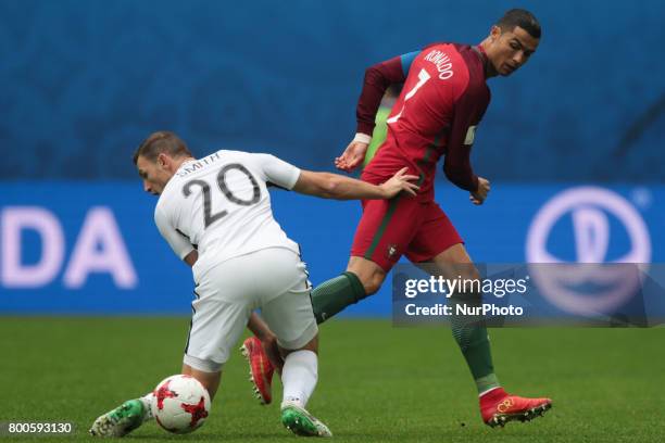 Tommy Smith of the New Zealand national football team and Cristiano Ronaldo of the Portugal national football team vie for the ball during the 2017...