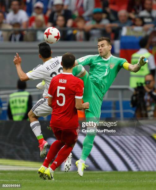 Hirving Lozano of Mexico national team heads the ball to score as Igor Akinfeev of Russia national team defends during the Group A - FIFA...