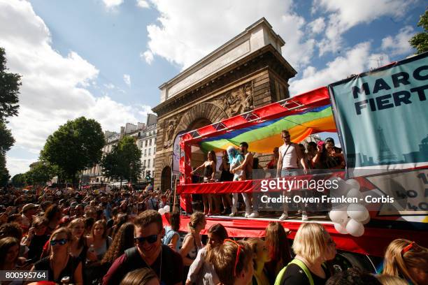 People participate in the Gay Pride Parade rally and march in the streets on June 24, 2017 in Paris, France.