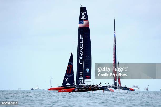 Skippered by Jimmy Spithill competes with Emirates Team New Zealand helmed by Peter Burling in race 6 during day 3 of the America's Cup Match...