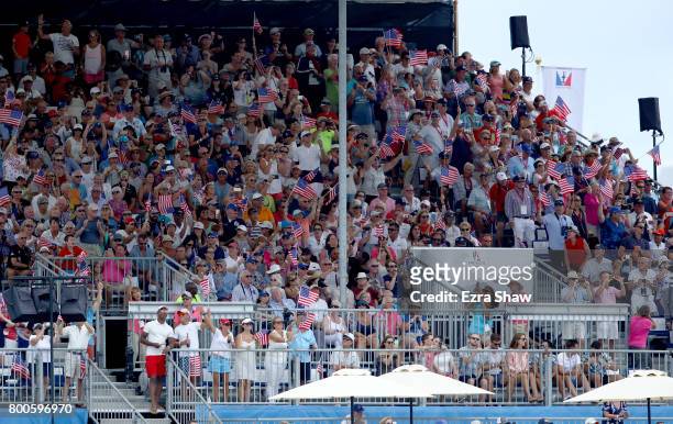 Fans wave American flags during Day 3 of the America's Cup Match Presented by Louis Vuitton on June 24, 2017 in Hamilton, Bermuda.