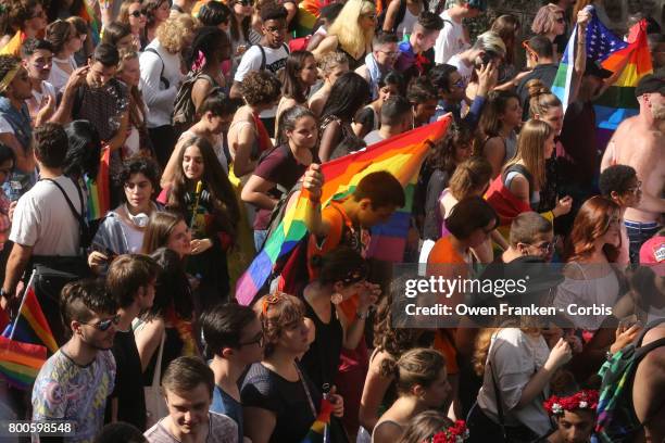 People participate in the Gay Pride Parade rally and march in the streets on June 24, 2017 in Paris, France.