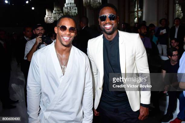 Football player Victor Cruz and basketball player Dwyane Wade attend the Balmain Menswear Spring/Summer 2018 show as part of Paris Fashion Week on...
