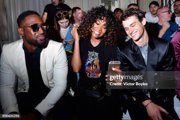 Dwyane Wade, Gabrielle Union and Brandon Flynn attend the Balmain Menswear Spring/Summer 2018 show as part of Paris Fashion Week on June 24, 2017 in...