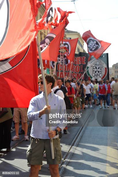 People carry flags during a protest against the law on Jus Soli, which would give birthright citizenships to children born to refugees living in...