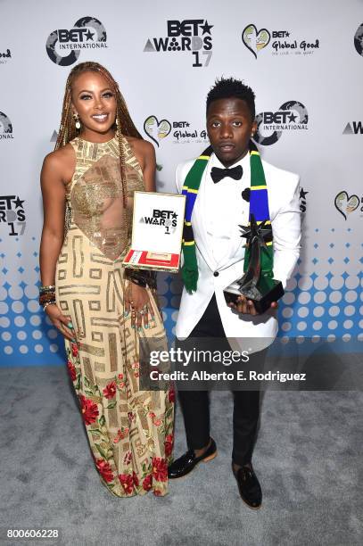 Host Eva Marcille and recording artist Ray Vanny, winner of the Best International Viewers' Choice Award, attend the 2017 BET International Awards...