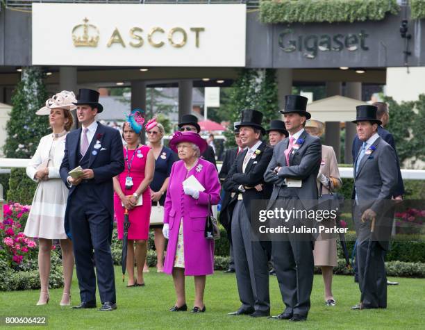 Queen Elizabeth II in the Parade ring with racegoers, watching a race on the big screen on day 5 of Royal Ascot at Ascot Racecourse on June 24, 2017...