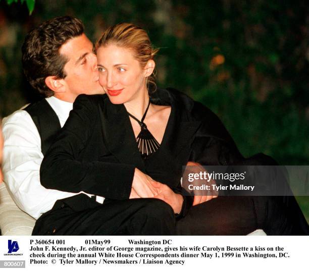 01May99 Washington DC John F. Kennedy, Jr. Editor of George magazine, gives his wife Carolyn Bessette a kiss on the cheek during the annual White...