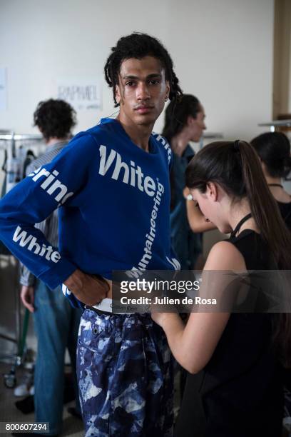Model prepares backstage before the White Mountaineering Menswear Spring/Summer 2018 show as part of Paris Fashion Week on June 24, 2017 in Paris,...
