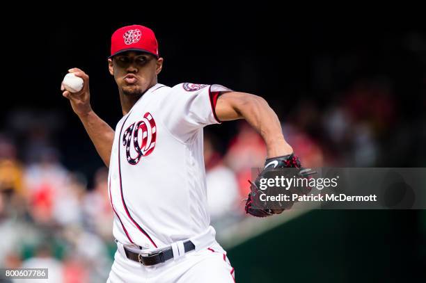 Starting pitcher Joe Ross of the Washington Nationals throws a pitch to a Cincinnati Reds batter in the first inning during a game at Nationals Park...