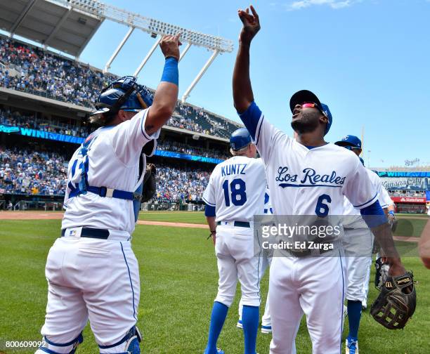 Salvador Perez of the Kansas City Royals and Lorenzo Cain celebrate a 3-2 win over the Toronto Blue Jays at Kauffman Stadium on June 24, 2017 in...