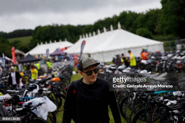 An athlete walks alongside the biking rack placed at Wimbleball Lake the day before of Ironman 70.3 UK Exmoor on June 24, 2017 in Somerset, United...
