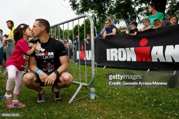 Father kisses his daughter prior to start the Iron Kids race the day before of Ironman 70.3 UK Exmoor at Wimbleball Lake on June 24, 2017 in...