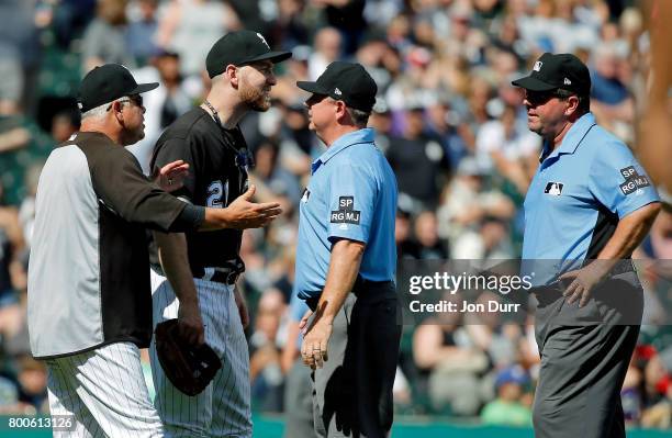 Manager Rick Renteria of the Chicago White Sox and Todd Frazier argue with second base umpire Greg Gibson and first base umpire Sam Holbrook after...