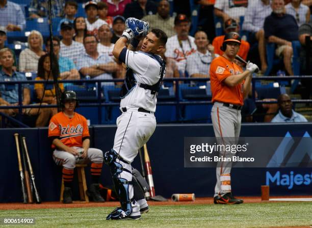 Catcher Wilson Ramos of the Tampa Bay Rays hauls in the pop foul by Paul Janish of the Baltimore Orioles to end the top of the fourth inning of a...