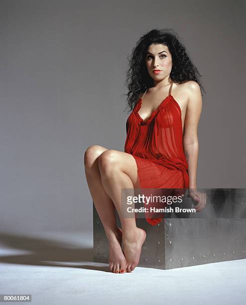 Singer Amy Winehouse poses for a portrait shoot for Harpers & Queen magazine in London November 6, 2003.