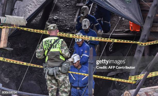 Miners descend into the El Cerezo mine during search operations after an explosion at the illegal coal mine killed at least eight people, in the...