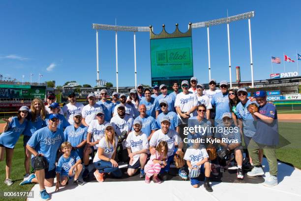 Celebrities gather on the field for a group photo during the Big Slick Celebrity Weekend benefitting Children's Mercy Hospital of Kansas City on June...