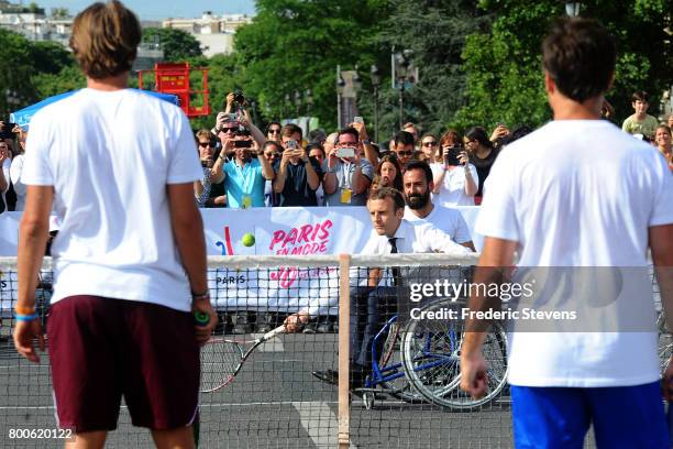 French President Emmanuel Macron plays tennis sitting in a wheelchair with Michael Jeremiasz and Lucas Pouille and Fabrice Santoro on Alexandre III...
