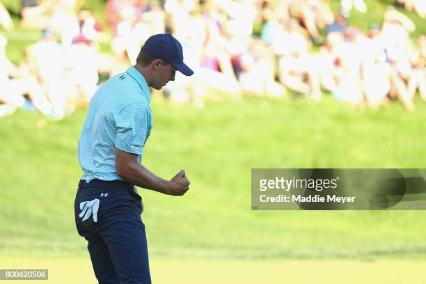 Jordan Spieth of the United States reacts after putting on the 18th green during the third round of the Travelers Championship at TPC River Highlands...