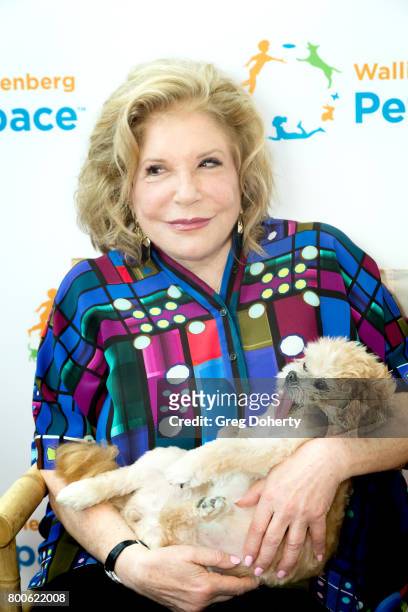 Philanthropist Wallis Annenberg and dog Marnie pose for a picture at the Grand Opening Celebration For The Wallis Annenberg PetSpace at the Wallis...