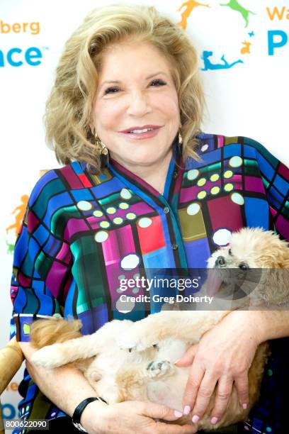 Philanthropist Wallis Annenberg and dog Marnie pose for a picture at the Grand Opening Celebration For The Wallis Annenberg PetSpace at the Wallis...