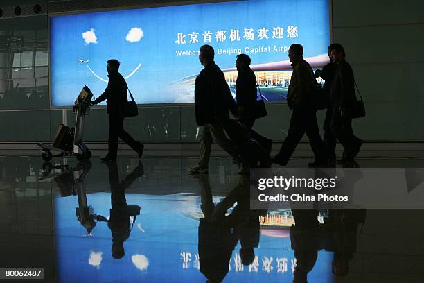 The first group of passengers arrive at the new terminal building T3 at the Beijing Capital International Airport February 29, 2008 in Beijing,...