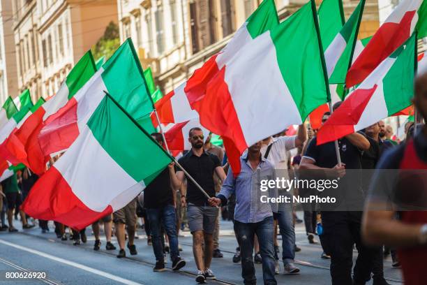 Thousands of members of Italian far-right movement CasaPound from all over Italy march with flags and shout slogans during a demonstration to protest...