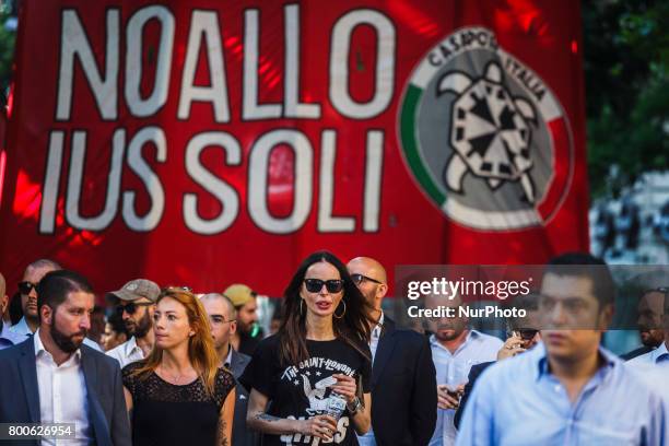 Nina Moric , a Croatian fashion model, marches as thousands of members of Italian far-right movement CasaPound from all over Italy march with flags...