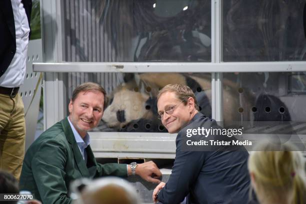 Berlin zoo director Andreas Knieriem and Berlin mayor Michael Mueller look at the Pada female Meng Meng on June 24, 2017 in Berlin, Germany.