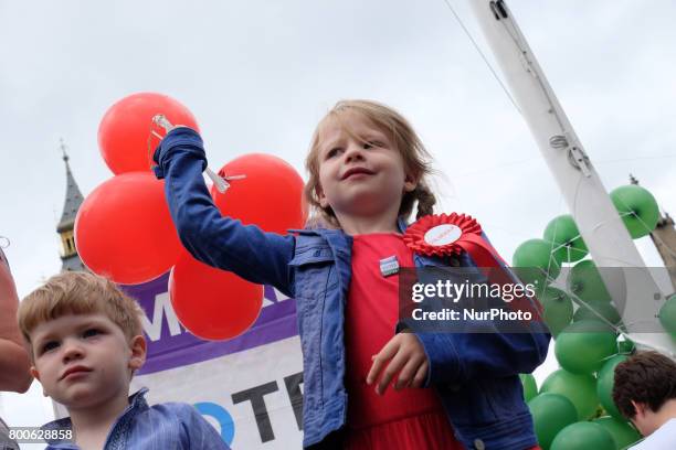 Balloons representing under-represented political parties are shown to demonstrate the vote share to seats in Parliament. The Make votes matter...