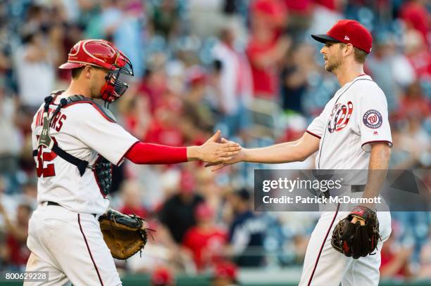 Jacob Turner and Matt Wieters of the Washington Nationals celebrate after the Nationals defeated the Cincinnati Reds 18-3 during a game at Nationals...